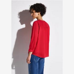 Blouse avec détails en tape