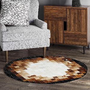 Get 43 off a handmade round cowhide rug in ombre brown black and white